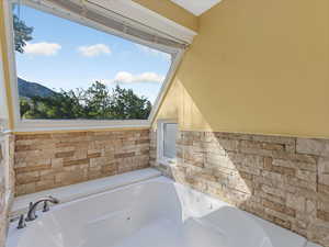 Full bathroom with a jetted tub