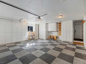 Garage featuring a garage door opener