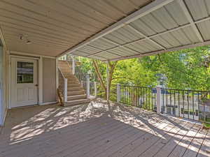 Wooden terrace featuring stairs