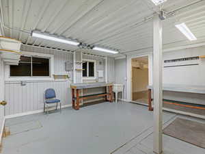 Misc room with finished concrete floors and baseboards