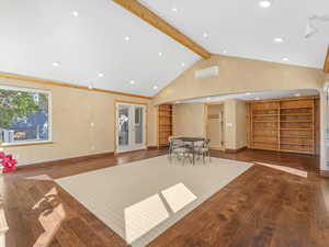 Common area featuring beam ceiling, recessed lighting, and high vaulted ceiling