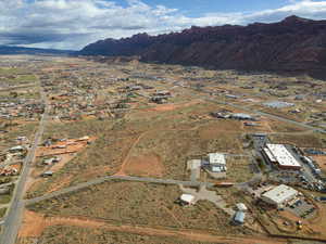 Aerial view of property's location with a mountainous background and rural landscape