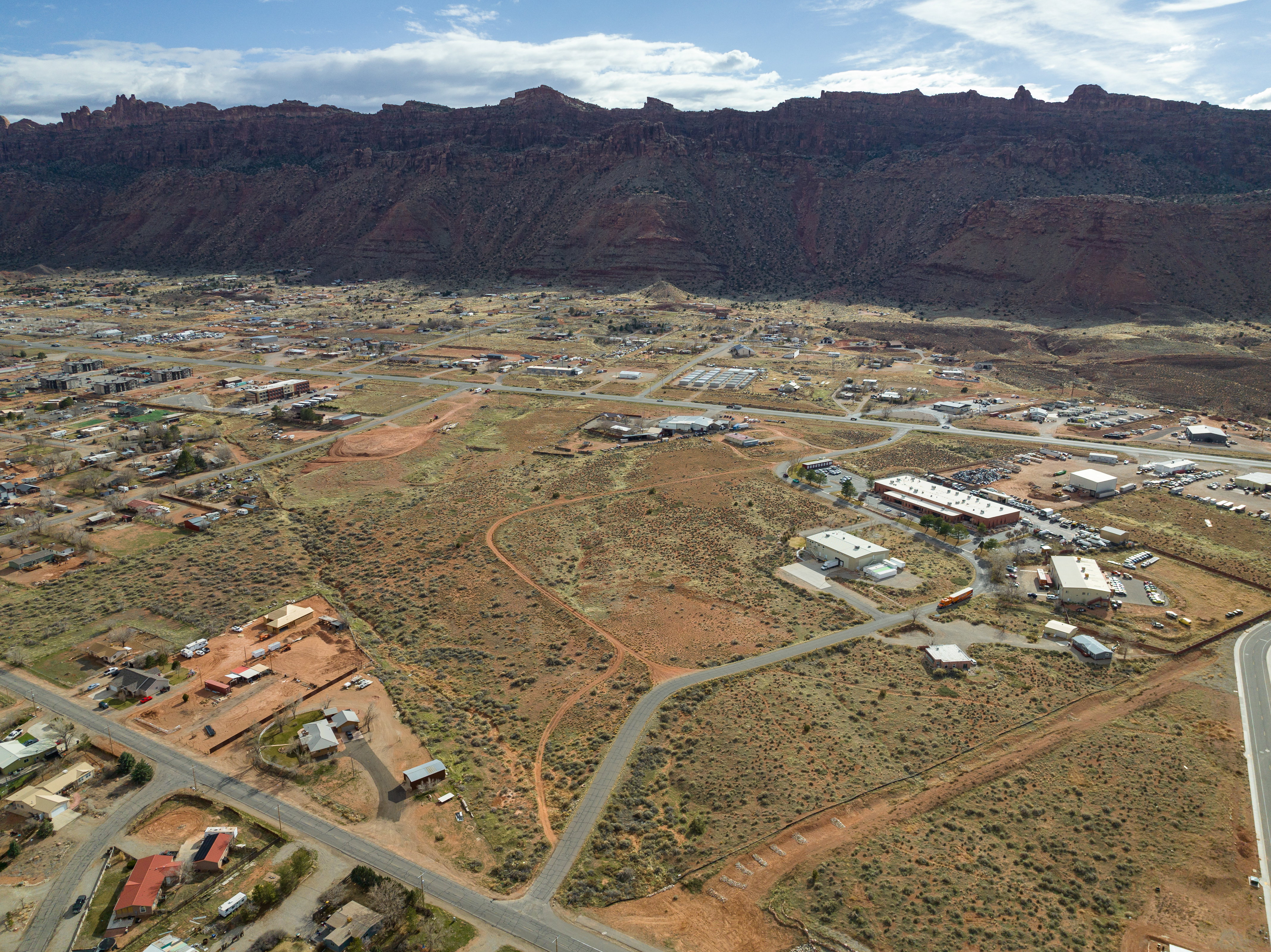 View of mountain backdrop with a desert landscape and rural landscape