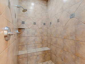 Bathroom with tiled shower