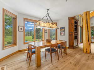 Dining space with light wood finished floors