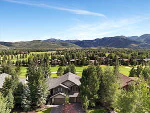 Mountain view featuring a golf club and nearby suburban area