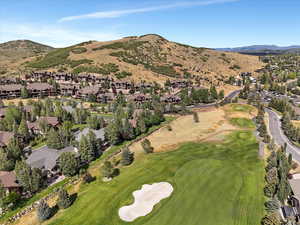View of property location featuring nearby suburban area and a local golf course