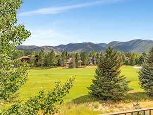 View of mountain backdrop featuring a golf course