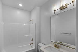 Bathroom with vanity and tub / shower combination