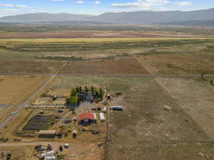 Aerial view of sparsely populated area with a mountain backdrop