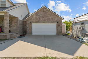 Garage with concrete driveway