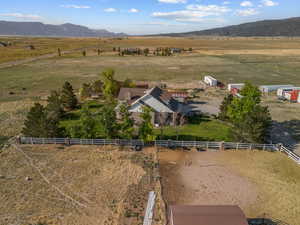 Aerial overview of property's location featuring rural landscape and mountains