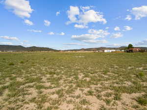 View of yard with a mountain view and a view of countryside
