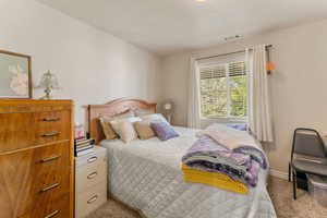 View of carpeted bedroom