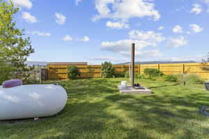 View of fenced backyard