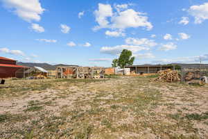 View of yard with exterior structure and an outbuilding