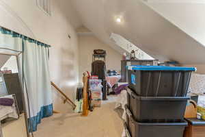 Bonus room with lofted ceiling and carpet floors