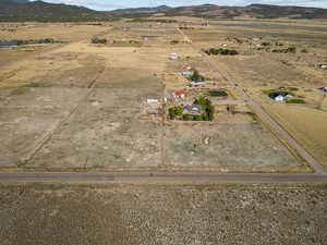 Aerial view of property's location featuring mountains and rural landscape