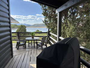 Wooden deck with a view of lake and mountains