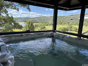 View of hot tub and mountains
