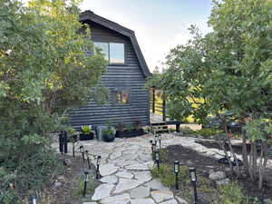 Stone walkway & patio leading to front door