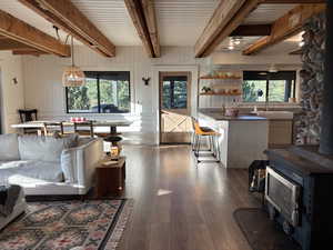 Front door entrance to dining and living room area with large windows and lots of natural light