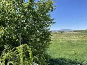 View of mountain backdrop with rural landscape