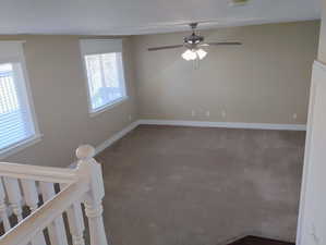 Spare room featuring carpet