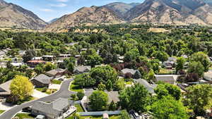 View of mountain backdrop featuring nearby suburban area