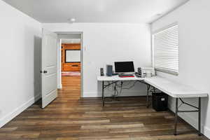 Office featuring dark wood-style floors and baseboards