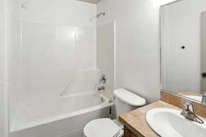 Full bath with vanity and shower / bath combination