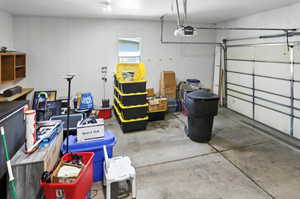 Garage featuring a garage door opener
