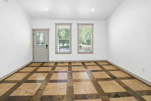 Entrance foyer featuring inlaid floor details and recessed lighting