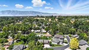 Aerial perspective of suburban area with a mountainous background