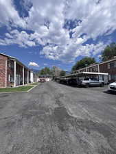 View of asphalt road with a residential view