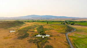 Aerial overview of property's location featuring a water and mountain view
