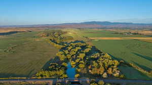 Aerial view of property's location featuring rural landscape and mountains