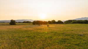 View of local wilderness featuring a mountain backdrop and rural landscape