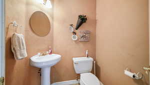 Half bath featuring toilet