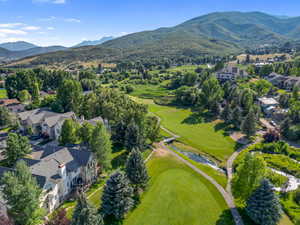 Aerial perspective of suburban area with a mountainous background