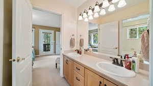 Jack n Jill bathroom with double vanity and plenty of natural light