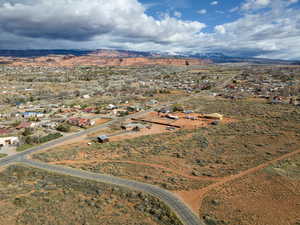 Aerial view of property and surrounding area with rural landscape and nearby suburban area