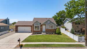 View of front of house with brick siding, driveway, an attached garage, and a shingled roof