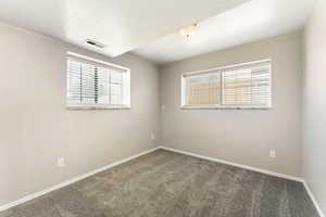 Carpeted empty room with plenty of natural light