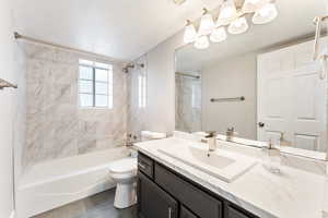Full bathroom featuring vanity and  shower combination