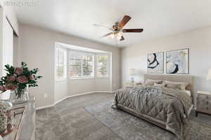 Bedroom with carpet and a ceiling fan