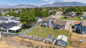 Aerial perspective of suburban area featuring a mountain backdrop