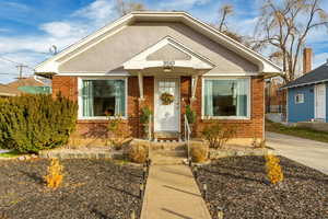 Bungalow-style home featuring brick siding
