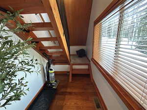 Interior space with lofted ceiling and wood finished floors