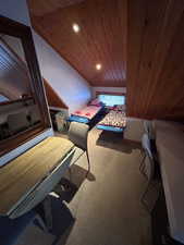 Bedroom featuring wood ceiling, recessed lighting, carpet flooring, and vaulted ceiling